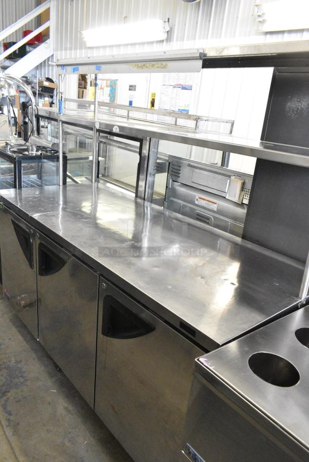 Turbo Air TUR-72SD-N Stainless Steel Commercial 3 Door Work Top Cooler w/ 2 Tier Over Shelf on Commercial Casters. 115 Volts, 1 Phase. Tested and Working! - Image 2 of 8