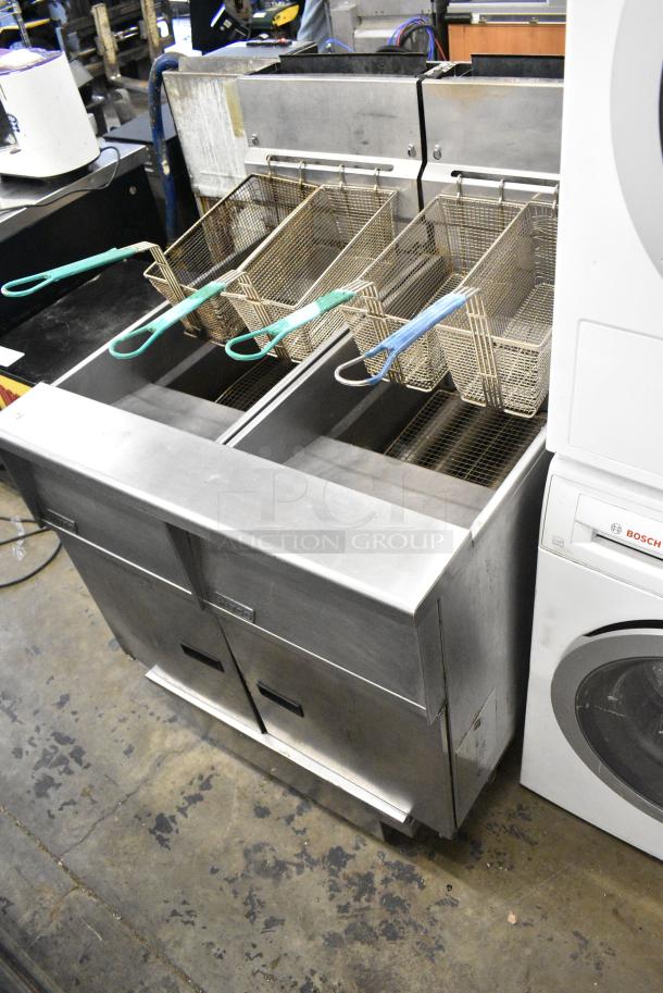 Pitco Frialator SG14 Stainless Steel Commercial Natural Gas Powered 2 Bay Deep Fat Fryer w/ 4 Metal Fry Baskets on Commercial Casters. - Image 3 of 10
