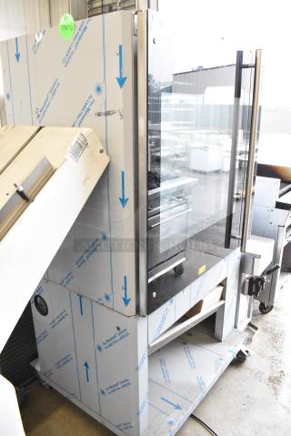 Frijado TDR 7-P Stainless Steel Commercial Electric Powered Rotisserie Oven on Commercial Casters. 208 Volts, 3 Phase.