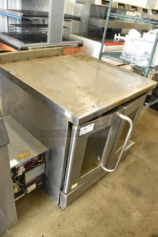 Montague Stainless Steel Commercial Natural Gas Powered Full Size Convection Oven w/ View Through Doors, Metal Oven Racks and Thermostatic Controls.