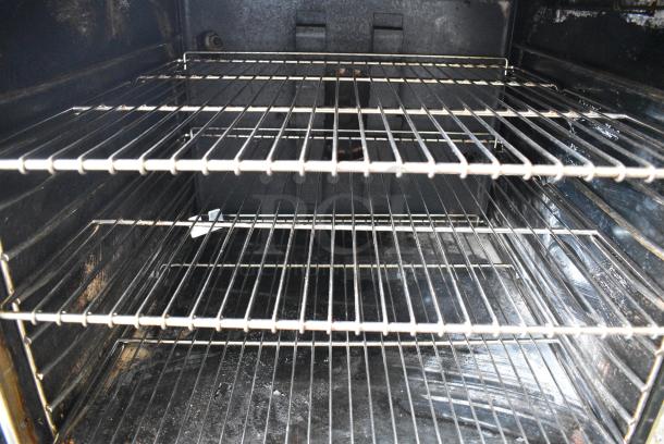 Montague Stainless Steel Commercial Natural Gas Powered Full Size Convection Oven w/ View Through Doors, Metal Oven Racks and Thermostatic Controls on Commercial Casters. - Image 3 of 8