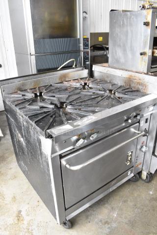 Montague Vectaire Stainless Steel Commercial Natural Gas Powered 4 Burner Range w/ CONVECTION Oven on Commercial Casters.