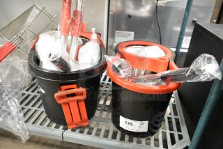2 BRAND NEW SCRATCH AND DENT! Mop Bucket w/ Handle and Mop Heads. 2 Times Your Bid!
