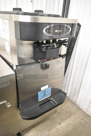 Taylor C723-33 Stainless Steel Commercial Floor Style Water Cooled 2 Flavor w/ Twist Soft Serve Ice Cream Machine on Commercial Casters. 208-230 Volts, 3 Phase.