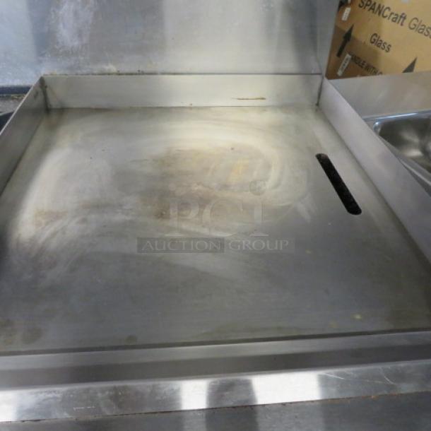 One Southbend 6 Burner/Griddle Natural Gas Range  With 4 Racks On Casters, 24 Inch Griddle With A Stainless Steel Over Shelf. 60.5X34.5X59.5. Model# S60DD-2GR. $8046.45 - Image 2 of 5