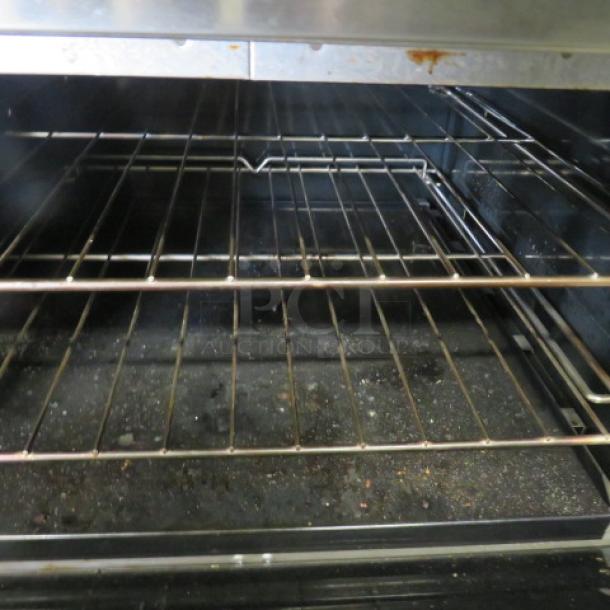 One Southbend 6 Burner/Griddle Natural Gas Range  With 4 Racks On Casters, 24 Inch Griddle With A Stainless Steel Over Shelf. 60.5X34.5X59.5. Model# S60DD-2GR. $8046.45 - Image 3 of 5
