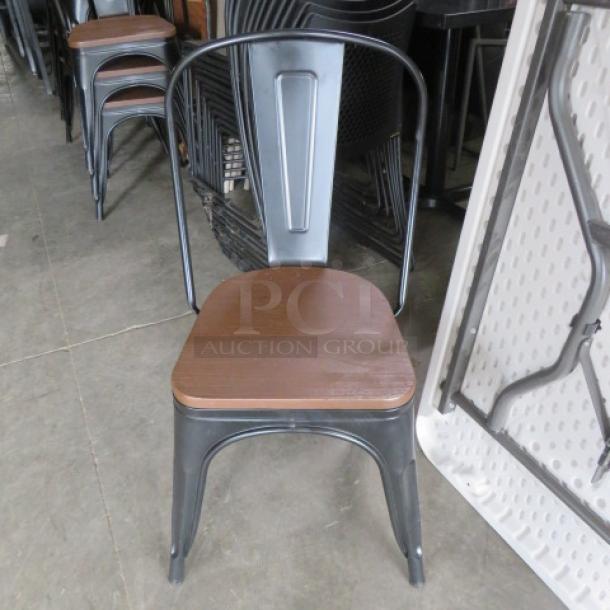 Black Metal Industrial Look Chair With A Wooden Seat. 2XBID - Image 1 of 1