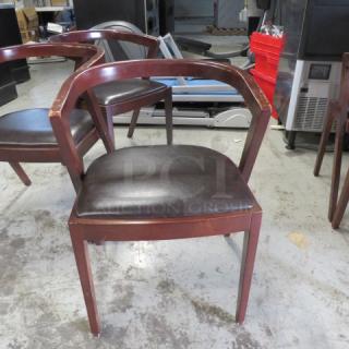 Wooden Chair With A Black Cushioned Seat And A Wooden Barrel Back. . 4XBID