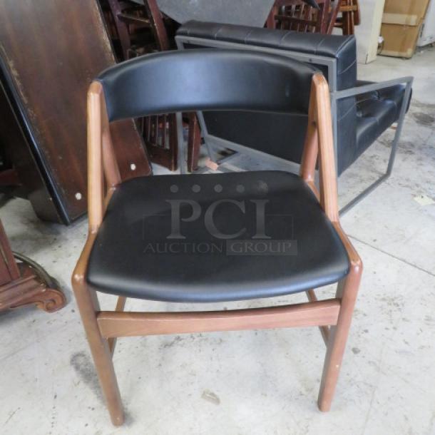 Wooden Chair With A Black Cushioned Seat And A Black Cushioned Barrel Back. . 3XBID - Image 1 of 2