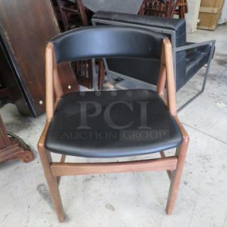 Wooden Chair With A Black Cushioned Seat And A Black Cushioned Barrel Back. 2XBID