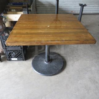 One Wooden Butcher Block Table Top On A Pedestal Base. 36X36X30