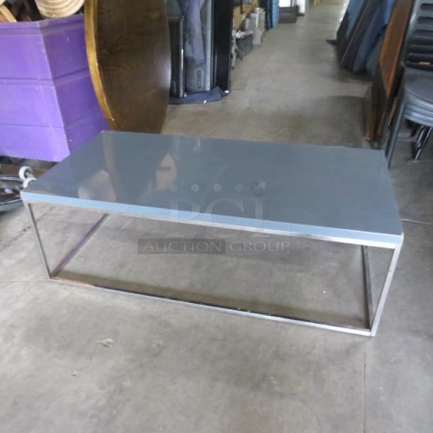 One Chrome Frame/Gray Laminate Look Coffee Table. 47X23.5X16 - Image 1 of 1