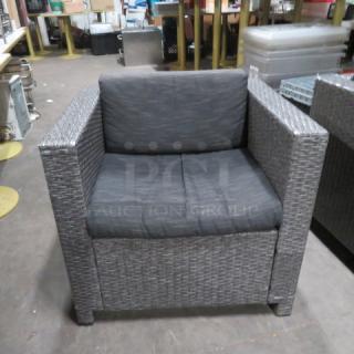 One Gray Wicker Patio Chair With Cushion. 9.5X25.5X26.5