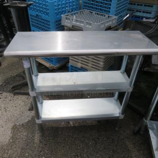 One Stainless Steel Table With 2 Stainless Steel Under Shelves.  14X36X35