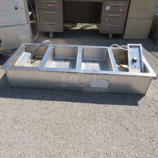 One Wells 4 Well Drop In Food Warmer. 208-240 Volt. 1 Phase. Model# MOD400TDMAF. 57.5X23.5X10. $6573.00. - Image 1 of 1