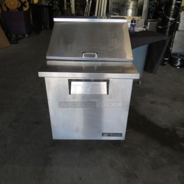 One WORKING True 1 Door Refrigerated Prep Table On Casters. Model# TSSU-27-12M-B. 115 Volt. 27.5X34X44. $3088.00. - Image 1 of 4