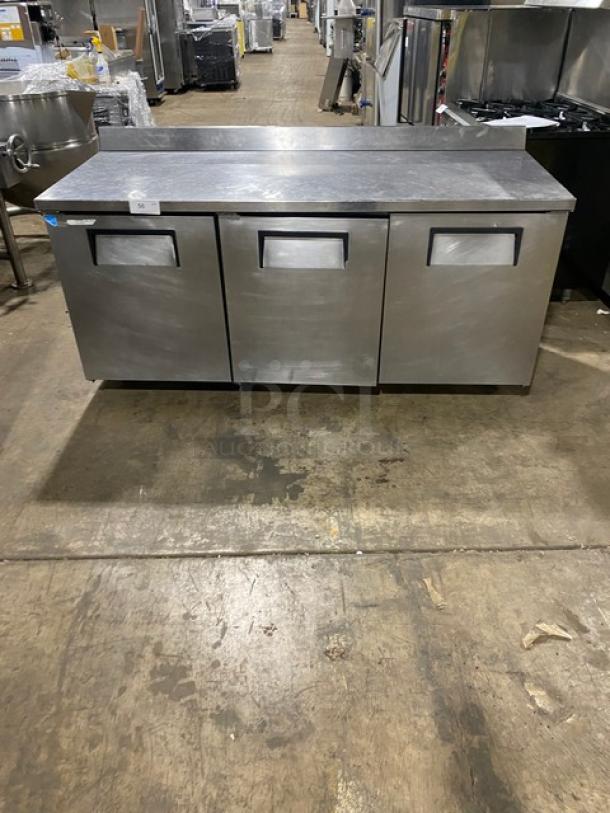 True Commercial Stainless Steel 3 Door Refrigerated 72" Worktop Table! Energy Star Certified! With Up Turned Back Splash! With Poly Coated Wire Racks! Model: TWT-72 SN: 7702017! 115V 1 Phase! On Casters! - Image 1 of 8