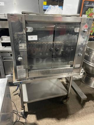 Rotisol! 2017 Late Model! Commercial Stainless Steel Natural Gas Powered Grand Flammes Millenium Vertical French Rotisserie! With Single Undershelf Equipment Cart! Model: 975.2 SN: 7533! 220-240V 1 Phase! On Casters!