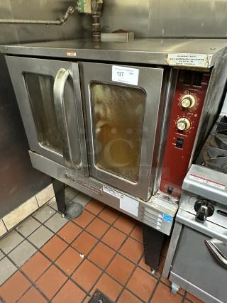Southbend Stainless Steel Commercial Natural Gas-Powered Full-Size Convection Oven w/ View Through Doors, Metal Oven Racks and Metal Legs.