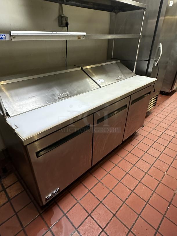 Arctic Air AST72R 71.5-Inch 3-Door Refrigerated Sandwich/Salad Prep Table 115v Powered On, with Cutlery Board - Image 1 of 7