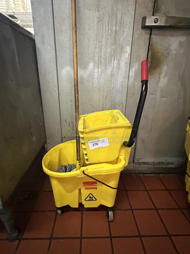 Rubbermaid® FG758088YEL WaveBrake® 35 Qt. Yellow Mop Bucket with Side Press Wringer 
Wood Mop handle & mop head - Image 1 of 2