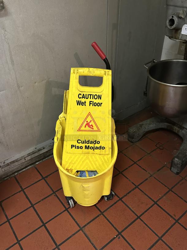 Rubbermaid® FG758088YEL WaveBrake® 35 Qt. Yellow Mop Bucket with Side Press Wringer
Caution Wet Floor Sign - Image 1 of 2