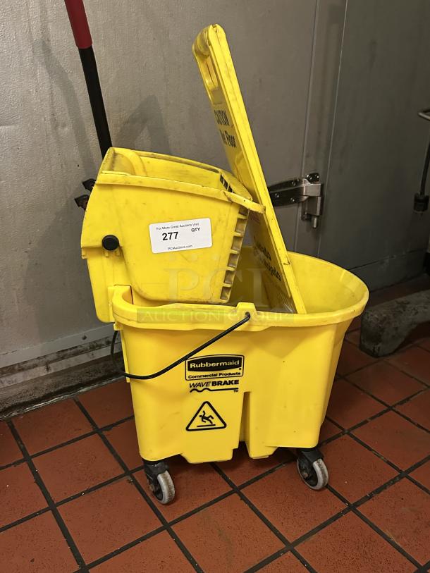 Rubbermaid® FG758088YEL WaveBrake® 35 Qt. Yellow Mop Bucket with Side Press Wringer
Caution Wet Floor Sign - Image 2 of 2
