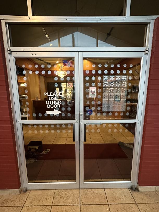 Complete Entry/Exit Metal Frame Door System. Includes Framework, 2 Glass Doors,  Auto Closures and top Glass Window Panels. BUYER MUST REMOVE. Door Size: 40"x84" Winning Bidder takes everything! Double Door with Glass Across Top, Locking Swing Out - Image 2 of 4