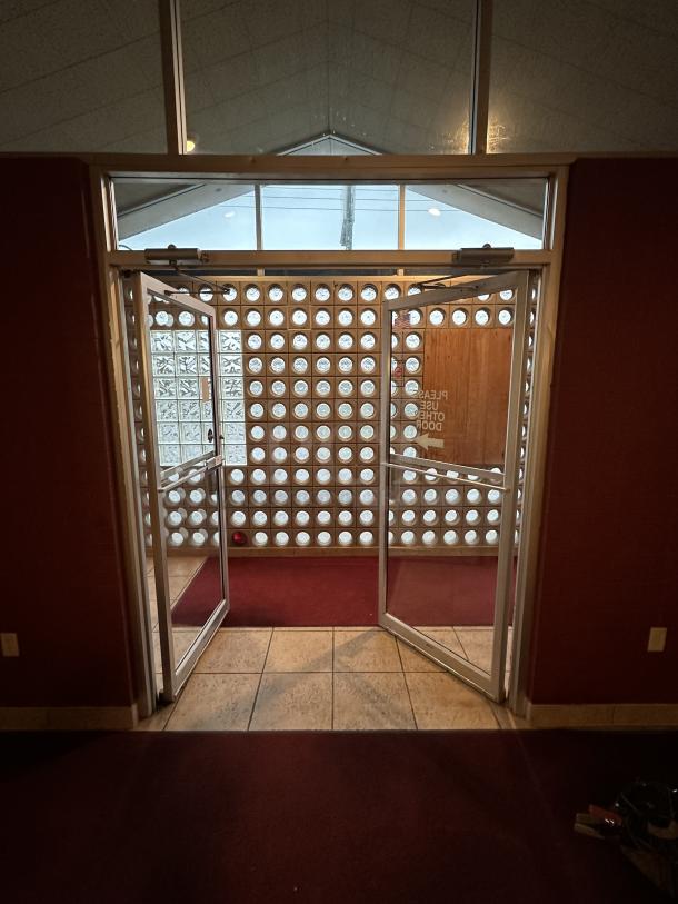 Complete Entry/Exit Metal Frame Door System. Includes Framework, 2 Glass Doors,  Auto Closures and top Glass Window Panels. BUYER MUST REMOVE. Door Size: 40"x84" Winning Bidder takes everything! Double Door with Glass Across Top, Locking Swing Out - Image 3 of 4