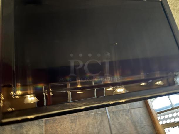 Seiki TV, on swivel base mounted to wall, 20X30 with remote - Image 2 of 5