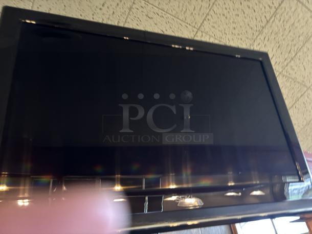 Seiki TV, on swivel base mounted to wall, 20X30 with remote - Image 3 of 5