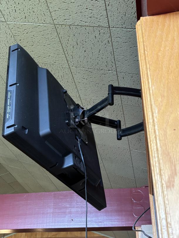 Seiki TV, on swivel base mounted to wall, 20X30 with remote - Image 5 of 5