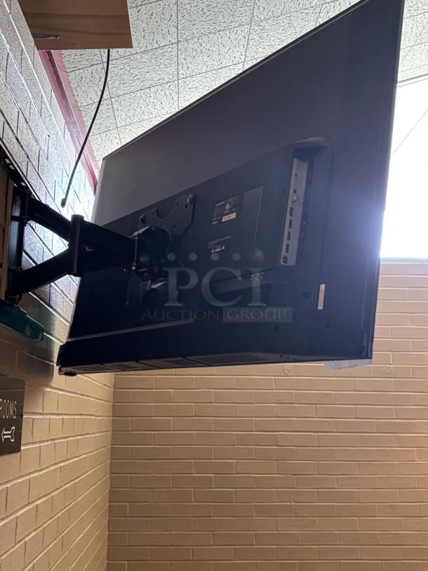 Hitachi Roku TV, swivel mounted to wall, you are responsible for detaching, powered on working 25x43in, with remote - Image 3 of 3