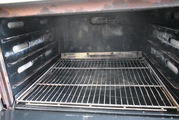 DCS Stainless Steel Commercial Natural Gas Powered 6 Burner Range w/ Oven, Over Shelf and Back Splash. - Image 6 of 7