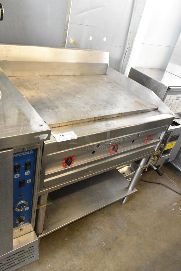 MagiKitch'n Stainless Steel Commercial Natural Gas Powered Flat Top Griddle w/ Thermostatic Controls and Metal Under Shelf. - Image 2 of 5