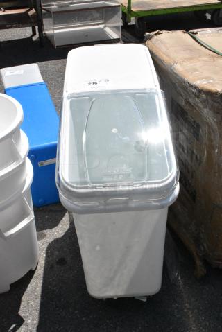 BRAND NEW SCRATCH AND DENT! Bakers Lane 176BIN21 Baker's Lane 21 Gallon / 335 Cup White Slant Top Mobile Ingredient Storage Bin with Sliding Lid & Scoop on Commercial Casters.