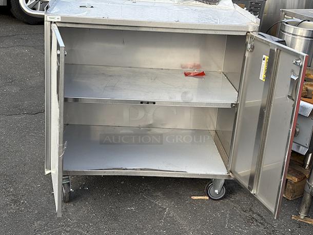BRAND NEW SCRATCH & DENT! Regency 21" x 33" Three Shelf 18-Gauge 304 Stainless Steel Utility Cart with Enclosed Base and Open Front. - Image 2 of 4