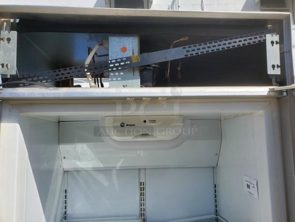 Monogram 36" Panel-Ready Integrated Column Refrigerator. The panel shown (5th picture) covers both the Refrigerator (this listing) and the Freezer unit (item #65). It is recommended that both units are purchased by the same buyer. Otherwise the panel will have to be altered so that each unit will still have a panel. - Image 6 of 8