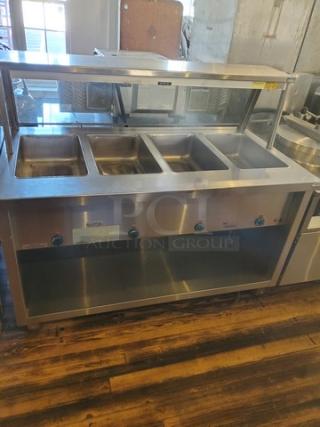 Duke TEHF-60SS 60" Hot Food Table w/ (4) Wells & Undershelf. 208V, 1 PH. Plug appears to have been cut. Will need to be rewired.