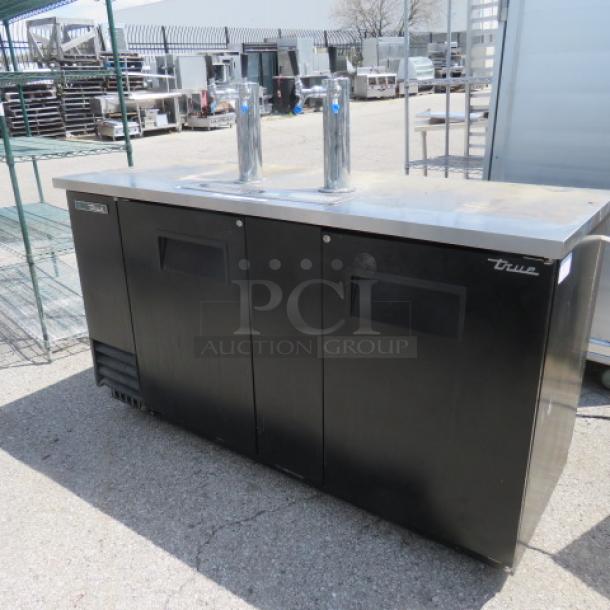 One WORKING True 2 Door Kegorator With 2 Towers, 4 Taps, And Drain Tray. 115 Volt.  Model# TDD-3-HC. 69X28X39. $3870.58 - Image 1 of 3