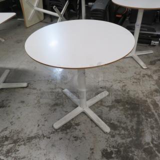 One IKEA White Laminate Tabletop On A Pedestal Base.  27.5X29