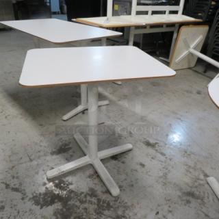 One IKEA White Laminate Tabletop On A Pedestal Base.  28X24X29