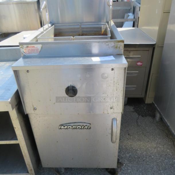 One 75lb  Imperial Natural Gas Deep Fryer On Casters And Basket. WORKING WHEN REMOVED. 19.5X35X45. $9438.00 - Image 1 of 3