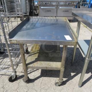 One Stainless Steel Equipment Table With under Shelf On Casters. 24.5X30X30