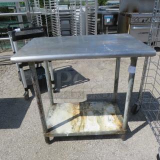 One Stainless Steel Table With under Shelf. 36X24X35.5