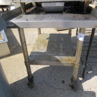 One Stainless Steel Equipment Table With A SS Under Shelf On Casters. 24.5X32X30