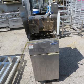 One Cook Rite Natural Gas Deep Fryer With 2 Baskets, R/L Side Splash On Casters. WORKING WHEN REMOVED. Model# ATFS40. 51.5X31X50