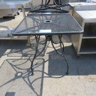 One Black Metal Patio Table With Umbrella Hole. 30X30X29
