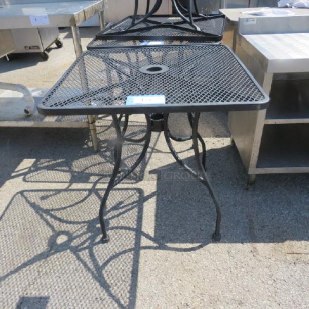 One Black Metal Patio Table With Umbrella Hole. 30X30X29 - Image 1 of 1