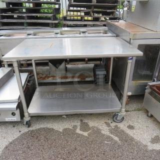 One Stainless Steel Table With A SS Under Shelf On Casters. 48X30X34